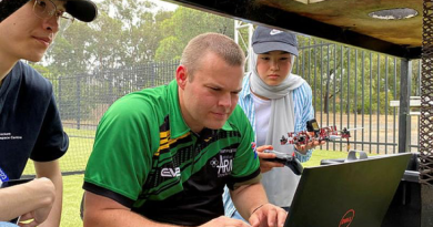 Sapper Alex Brown helps Year 10 student Adiba to code her drone at RMIT’s Girls in Aerospace and Defence program in Bundoora.