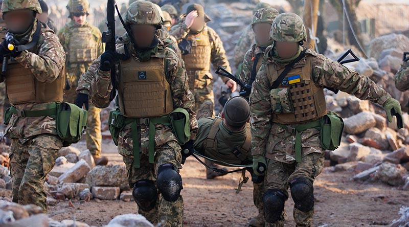 Ukrainian trainees rehearse medical-evacuation drills during the urban phase on the Australian Army’s first rotation of Operation Kudu in the United Kingdom. Photo by Corporal Dustin Anderson.