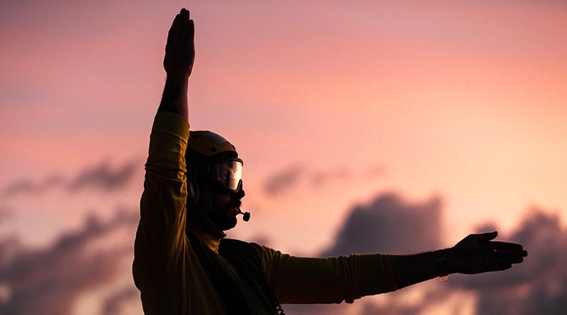 Leading Seaman Aviation Technician Aircraft Julijan Pavin marshals personnel as HMAS Hobart’s embarked MH-60R helicopter conducts deck landing practice while transiting through the Indonesian Archipelago during a Regional Presence Deployment. Photo by Leading Seaman Daniel Goodman.