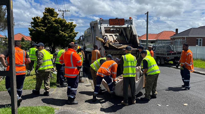 New Zealand Defence Force personnel help local authorities to clean up flood-damaged household good ahead of forecast Cyclone Gabrielle. NZDF photo.