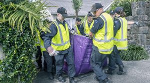 New Zealand Defence Force personnel help local authorities to clean up flood-damaged household good ahead of forecast Cyclone Gabrielle. NZDF photo.