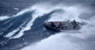 Royal New Zealand sailors from HMNZS Te Mana bring a rescued sailor back to their ship during Cyclone Gabrielle. NZDF photo.