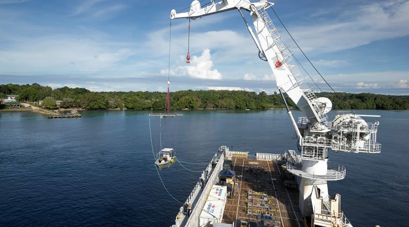 An Australian Army hydrographic vessel, from Littoral Riverine Survey Squadron, is hoisted into the water in Temotu Province, Solomon Islands. Story by Flight Lieutenant Lily Lancaster. Photos by Leading Aircraftman Sam Price.