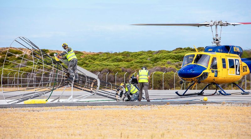 Navy personnel from Helicopter Support Facility and civilian contracted personnel from McDermott Aviation conduct torpedo recoveries at HMAS Stirling, Western Australia. Story by Lieutenant Commander Will Singer. Photo by Leading Seaman Ernesto Sanchez.