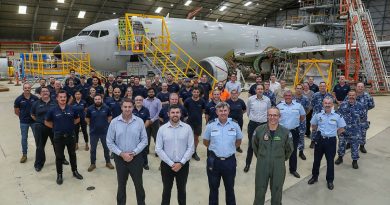 Members of the first P-8A Poseidon Depot Maintenance at RAAF Base Edinburgh including front second from left, Boeing Defence Australia P-8A Program Manager, David Kleinitz, and front right, Officer Commanding 92 Wing, Group Captain Paul Carpenter. Photo by Corporal Brenton Kwaterski.