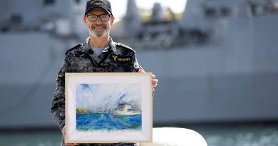 Leading Seaman Geoff Anthony displays his watercolour painting of HMAS Choules at Garden Island, Sydney. Story and photo by Private Nicholas Marquis.