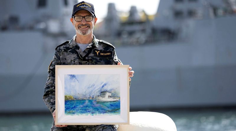 Leading Seaman Geoff Anthony displays his watercolour painting of HMAS Choules at Garden Island, Sydney. Story and photo by Private Nicholas Marquis.