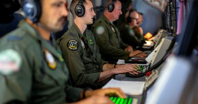 RAAF Tactical Coordinator Flight Lieutenant Brad Jolly, centre, at his station on-board a P-8A Poseidon during Operation Argos 2023. Story by Flying Officer Connor Bellhouse. Photo by Sergeant Nicci Freeman.