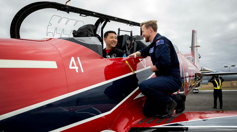 Major Eun-Ho Yang from the Republic of Korea Air Force aerobatic team The Black Eagles sits in a Pilatus PC-21 from the Royal Australian Air Force aerobatic team The Roulettes while Flight Lieutenant Ben Hepworth shows him the cockpit after a Friendship flight as part of the Australian International Air Show 2023. Photo by Leading Aircraftwoman Kate Czerny.