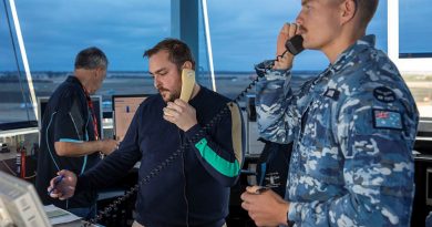 Flight Lieutenant Maxim David, from 453 Squadron, and Michael Mihalic, from Airservices Australia, at work in the air traffic control tower at the Australian International Airshow 2023. Story by By Flying Officer Shan Arachchi Galappatthy. Photo by LAC Chris Tsakisiris.