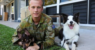 Army Sapper Flynn Skerke-Erwin, of the 3rd Combat Engineer Regiment, with trainee explosive detection dogs Joey, left, and Ash. Story and photo by Warrant Officer Class 2 Max Bree.