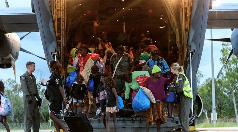 Air Force personnel assist residents as they are evacuated from the Kalkarindji area in the Northern Territory. Photo by Corporal Ashley Gillett.