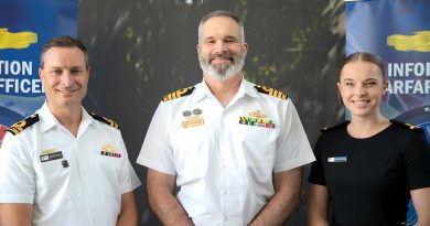 From left, information warfare officers Lieutenant Jordan Roney, Captain Andrew Macalister and Sub-Lieutenant Jacqui Meacle celebrate the work group’s first anniversary as a primary qualification. Story and photo by Corporal Michael Rogers.