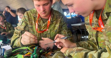 Australian Army Cadets, Sergeant Kyle Croghan, left, and Corporal Lewis Sanderson repair a racing drone at the 2023 Avalon International Airshow. Photo by Warrant Officer Class 2 Mick Davis.