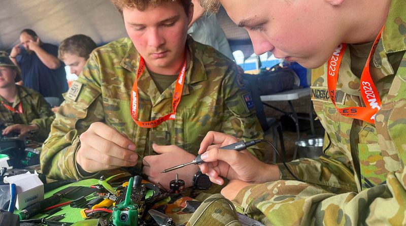 Australian Army Cadets, Sergeant Kyle Croghan, left, and Corporal Lewis Sanderson repair a racing drone at the 2023 Avalon International Airshow. Photo by Warrant Officer Class 2 Mick Davis.