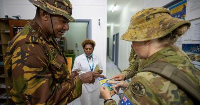 Australian Army medic Sergeant Kathleen Cole speaks with Papua New Guinea Defence Force Warrant Officer Class 2 Jerry Aini at Murray Barracks Health Centre, Port Moresby. Story Captain Joanne Leca. Photo by Corporal Brandon Grey.