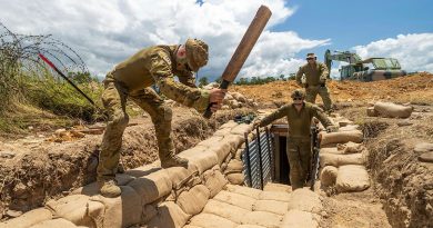 Sapper Dean Ridgeway tamps sandbags during a trench construction activity in Townsville. Story by Major Taylor Lynch. Photos by Sergeant Brodie Cross.