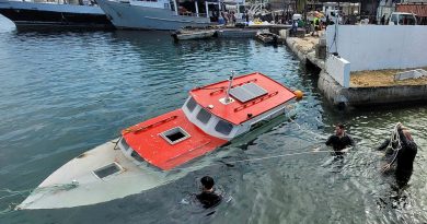 Members of Australian Clearance Diving Team One conduct a salvage diving operation in Port Vila Harbour during Operation Vanuatu Assist. Story by Lieutenant Geoff Long. Photo by Able Seaman Michaela Bennett.