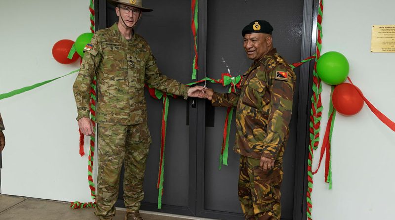 Australia's Chief of Defence Force General Angus Campbell, left, and Commander of the Papua New Guinea Defence Force Major General Mark Goina, cut the ribbon to refurbished soldiers accommodation at Taurama Barracks, Papua New Guinea. Story by Captain Joanne Leca. Photo by Corporal Brandon Grey.