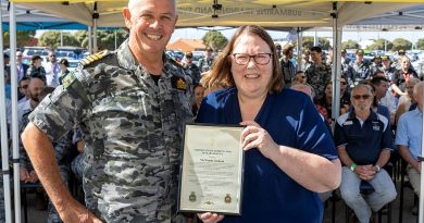 Director Training Authority - Submarines Captain Richard Lindsey, left, presents a certificate of appreciation to Wendy Jackson for 30 years of service at the Submarine Training and Systems Centre at HMAS Stirling. Story by Corporal Jacob Joseph. Photo by Chief Petty Officer Yuri Ramsey.