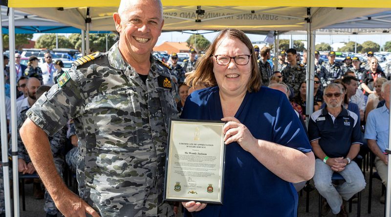 Director Training Authority - Submarines Captain Richard Lindsey, left, presents a certificate of appreciation to Wendy Jackson for 30 years of service at the Submarine Training and Systems Centre at HMAS Stirling. Story by Corporal Jacob Joseph. Photo by Chief Petty Officer Yuri Ramsey.