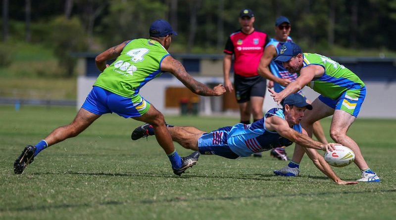 Flight Lieutenant David Murray splits the defence in a desperate dive for the line against ACT Raiders. Story by Squadron Leader Pete Croce.