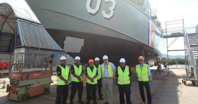 Director RMC North East Mick Saunders with crew members from Lomor and the Norship CEO Olav Groot in Cairns. Story by Claudia Henry. Photo by Warrant Officer Danny Taylor.