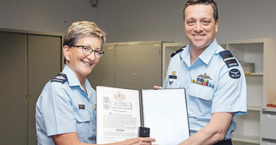 Commander Air Warfare Centre Air Commodore Adrian Maso presenting Warrant Officer Janet Brennan with her Federation Star. Story by Flight Lieutenant Rob Hodgson. Photo by Leading Aircraftwoman Annika Smit.