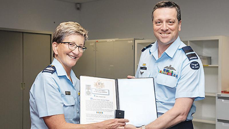 Commander Air Warfare Centre Air Commodore Adrian Maso presenting Warrant Officer Janet Brennan with her Federation Star. Story by Flight Lieutenant Rob Hodgson. Photo by Leading Aircraftwoman Annika Smit.