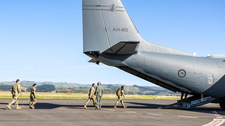 New Zealand Army personnel embark a RAAF C-27J Spartan to assist a remote community affected by Tropical Cyclone Gabrielle. Story by Flight Lieutenant Vernon . Photo by Leading Seaman Nadav Harel.