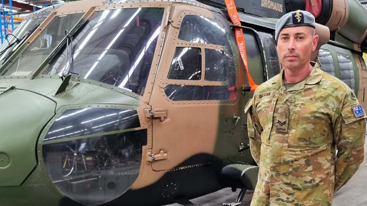 Corporal Paul Quilliam next to an old S70 Black Hawk at the Rotary-Wing Aircraft Maintenance School in Oakey. Story by Warrant Officer Class 2 Max Bree.