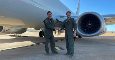 Warrant Officer Paul Gregory, left, with Flight Lieutenant Bradley McMaster, celebrates achieving over 9000 flying hours of service. Story by Flight Lieutenant Claire Burnet.