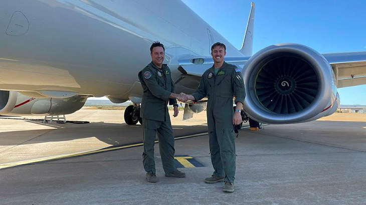 Warrant Officer Paul Gregory, left, with Flight Lieutenant Bradley McMaster, celebrates achieving over 9000 flying hours of service. Story by Flight Lieutenant Claire Burnet.