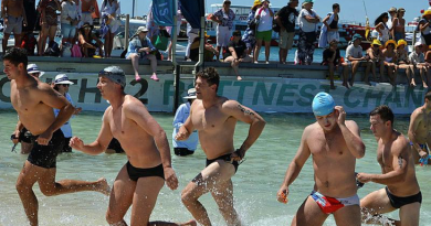 Soldiers and officers from 16th Battalion, The Royal Western Australia Regiment, and 10th Light Horse Regiment run to shore during the Rottnest Channel Swim. Story by Major Sandra Seman-Bourke. Photo by Lieutenant Colonel Lachlan Bromley.