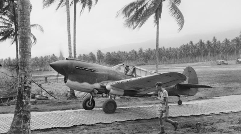 RAAF Squadron Leader Keith W 'Bluey' Truscott taxiing his P-40E Kittyhawk along the Marston Mats at Milne Bay Fighter Strip #3, Milne Bay, New Guinea, Sep 1942. Photo courtesy Australian War Memorial.