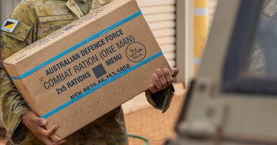Australian Army soldier load rations on to a G-Wagon during a flood-assist operation. Image digitally altered by CONTACT.