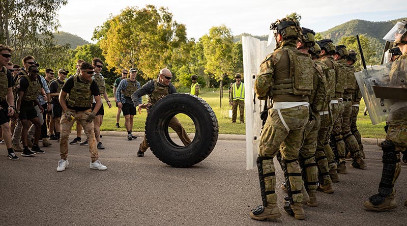 Australian Army soldiers from 3rd Battalion, Royal Australian Regiment and 1st Military Police Battalion defend against role players as part of a Populations Protection Control course at Lavarack Barracks in Townsville, Queensland. Photo by Bombardier Guy Sadler.