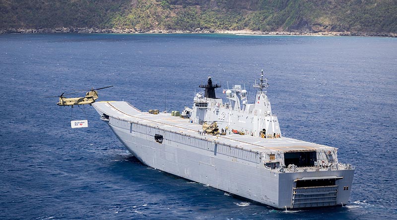 An Australian Army CH-47 Chinook takes off from HMAS Canberra near the coast of Futuna Island to conduct a vertical replenishment during Operation Vanuatu Assist 2023. Photo by Leading Seaman Matthew Lyall.