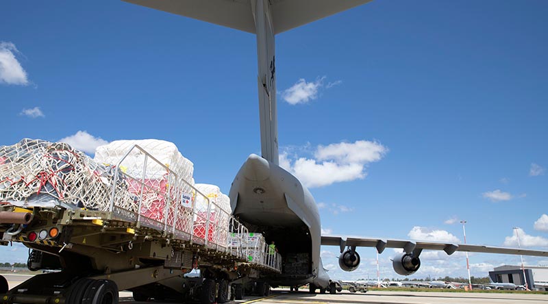 Humanitarian aid supplies are loaded onto a C-17A Globemaster heading to Vanuatu as part of the Australian government’s response to Tropical Cyclones Judy and Kevin. Photo by Leading Aircraftwoman Taylor Anderson.