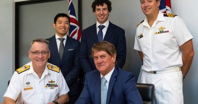 Rear Admiral Steven Tiffen, front left, signs a contract with Noakes Group Managing Director Sean Langman, front right, with members from Mine Warfare and Clearance Diving Systems Program Office and Noakes Group. Story by Phillip Morton. Photo by Able Seaman Benjamin Ricketts.