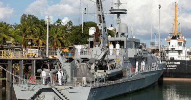 Ship's company of HMAS Armidale line the upper decks during the decommissioning ceremony. Story by Lieutenant Harrison Thomas. Photo by Petty Officer Peter Thompson.