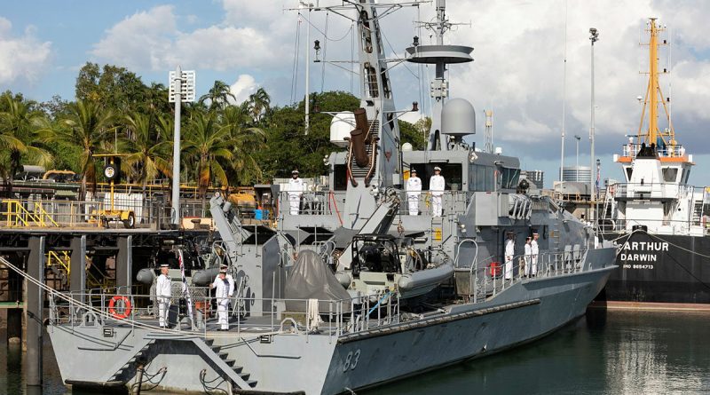 Ship's company of HMAS Armidale line the upper decks during the decommissioning ceremony. Story by Lieutenant Harrison Thomas. Photo by Petty Officer Peter Thompson.