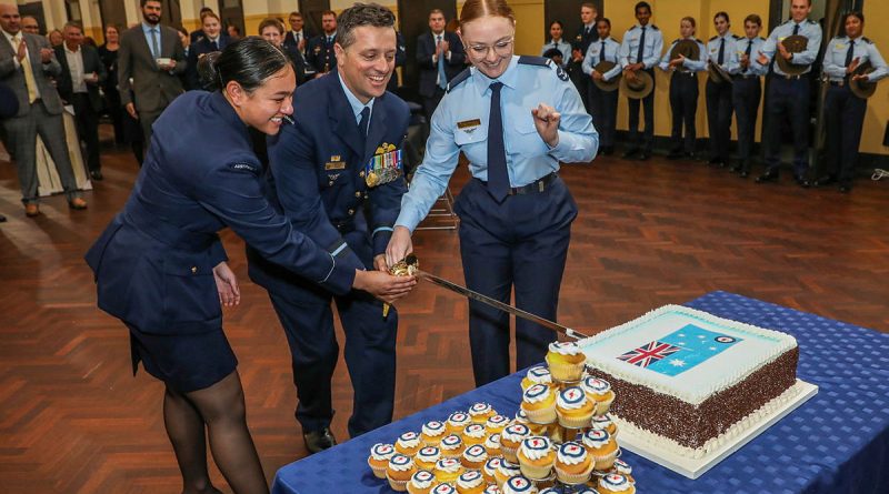 Senior ADF Officer Edinburgh Air Commodore Adrian Maso, Flying Officer Trish Noah and Aircraftwoman Emily Wellington cut the cake to mark the 102nd anniversary of the formation of the RAAF. Story by Wing Commander Nicola Frost and Squadron Leader Courtney Jay. Photo by Corporal Brenton Kwaterski.