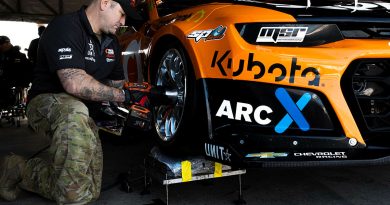 Warrant Officer Class Two Luke Parlor, a mechanic from Defence Force School of Signals conducts maintenance on a V8 Supercar at the Australian Formula 1 Grand Prix in Melbourne. Story by Flight Lieutenant Marina Power. Photo by Leading Aircraftwoman Taylor Anderson.