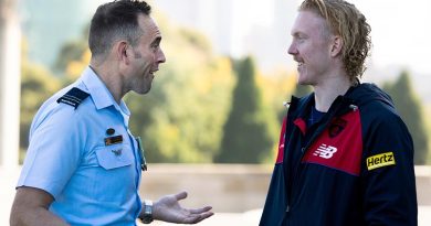 Flight Lieutenant Adon Lumley chats with Clayton Oliver from the Melbourne Football Club on ANZAC Day at The Shrine of Remembrance, Melbourne. Photo by Leading Aircraftman Ryan Howell.