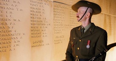 Musician Scott Collinson, from the Australian Army Band, stands beside the name of his relative, Private Alexander Walker, before the Anzac Day Dawn Service at the Australian National Memorial in Villers-Bretonneux, France. Photo by Sergeant Oliver Carter.