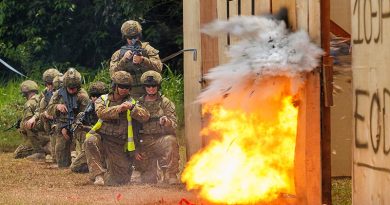 Australian soldiers use an explosive breaching charge to blow open a doorway at the Baturaja Training Area in Indonesia during Exercise Wirra Jaya. Photo by Corporal Dustin Anderson.