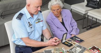 Wing Commander Adam Robinson reminisces with 100-year-old Dorothy Craig about her spouse, WWII RAAF veteran Lloyd Craig, who died in 1962. Photo by Corporal Brenton Kwaterski.