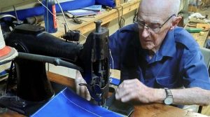 Jack Hamilton sewing Navy kitbags in his workroom at the Queensland Maritime Museum.