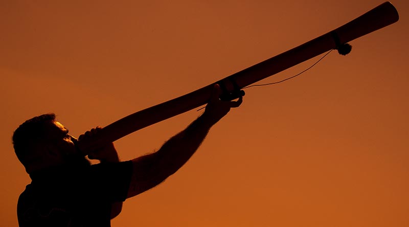 Leading Seaman Joseph Canning rehearses with his didgeridoo at ANZAC Cove on the Gallipoli peninsula in Türkiye. Photo by Corporal Madhur Chitnis.